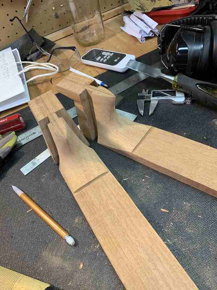 Two classical guitar necks showing the spanish heel construction